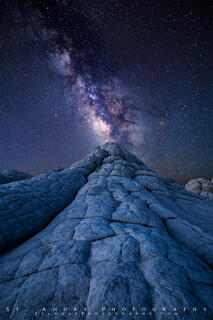 A large dome of white sandstone leads viewers towards the Milkyway as it moves across the sky. 