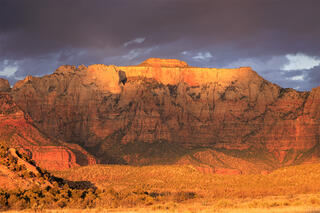 The west temple with great light highlighting the top of the mountain.