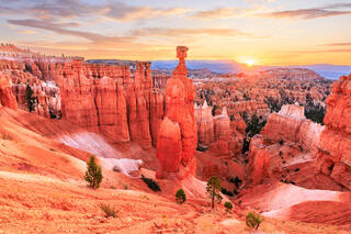Thors hammer at dawn with a radian sun rising to the right of the image
