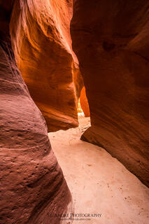 A slot canyon, Red Cave, in southern Utah with color sandstone walls.