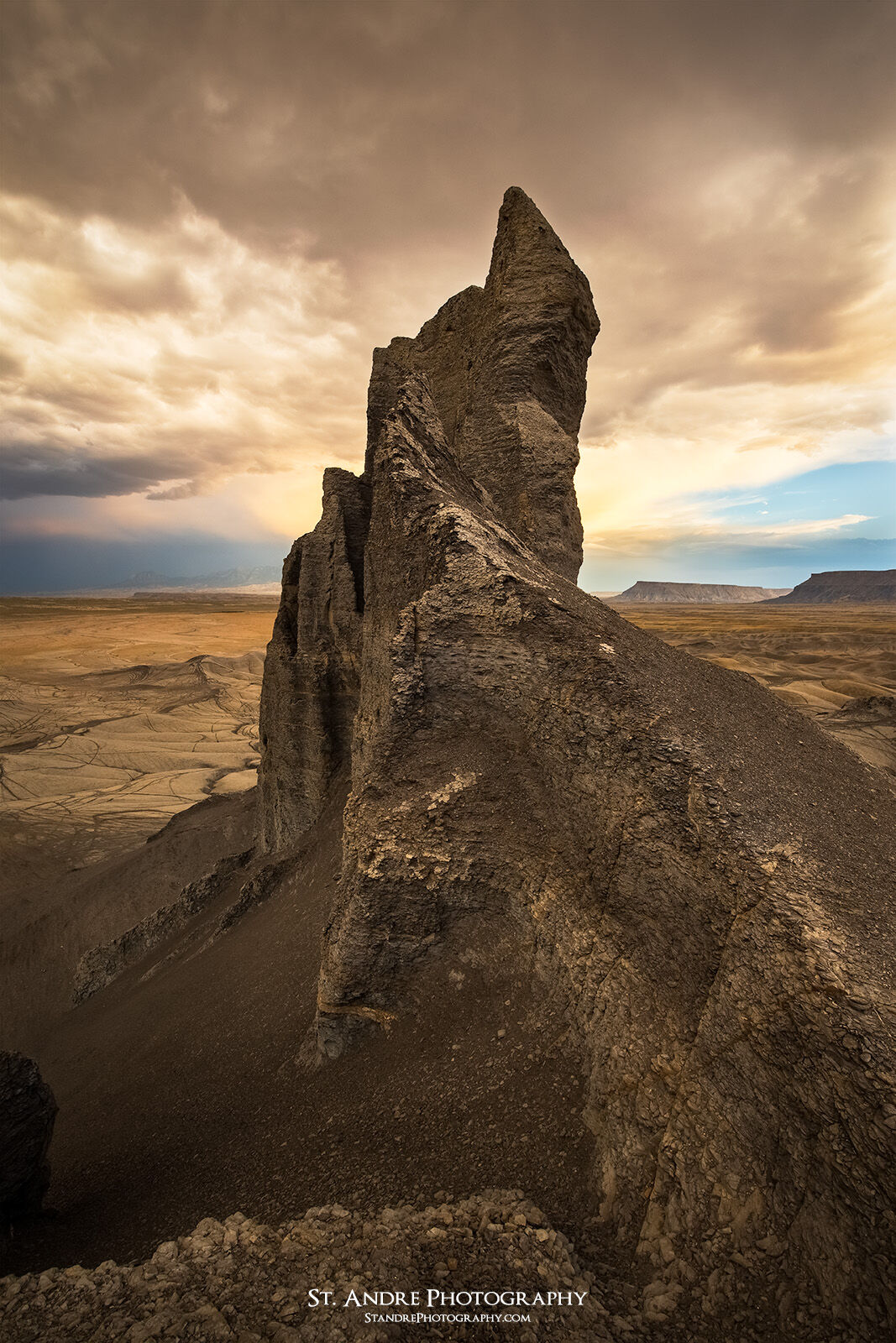 A dark stony tower located near Hanksville, Utah. This sits in the badlands that surround Factory Butte in Southern Utah. 