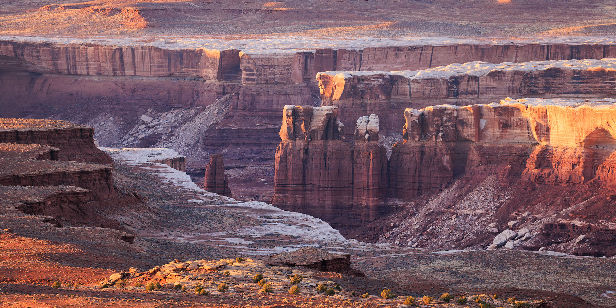 Layered Canyons Red rock landscape with light dancing across it.