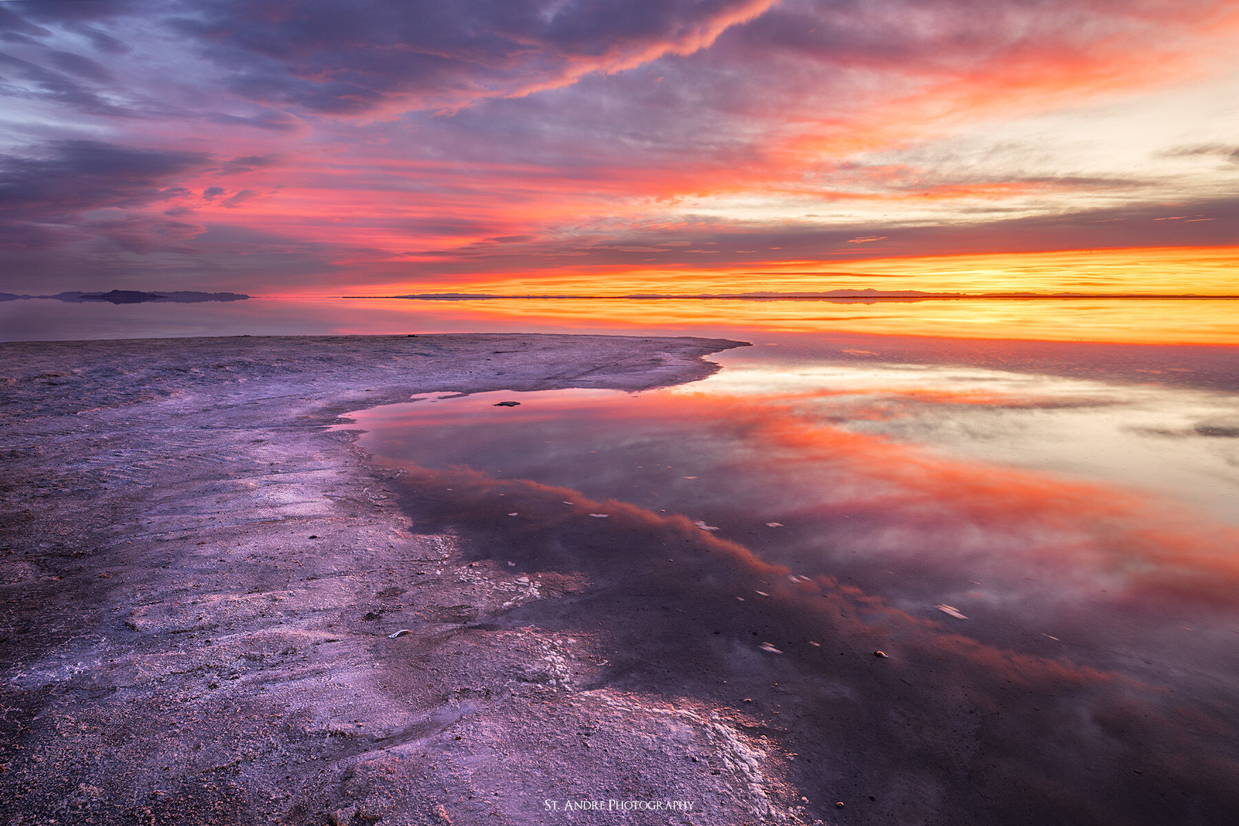 A dramatically colorful sunrise at the salt flats of western Utah