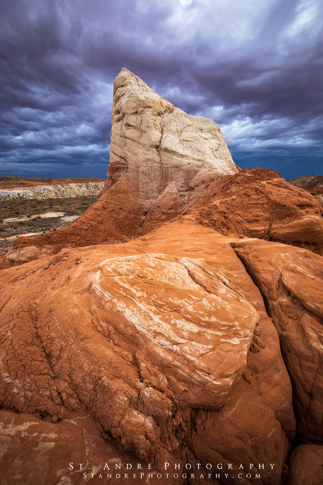 A large white sandstone structure growing out of the earth. 