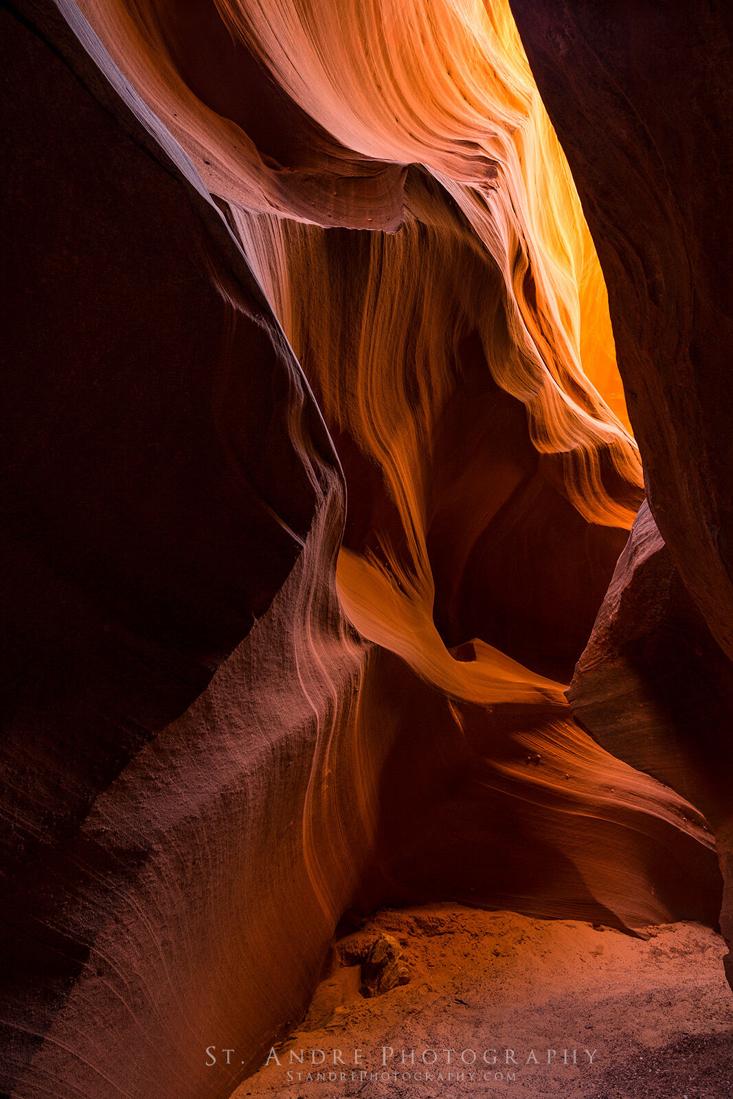 Water Pocket Slot canyon in Northern Arizona. Crimson colors are lit up by the reflected light. 