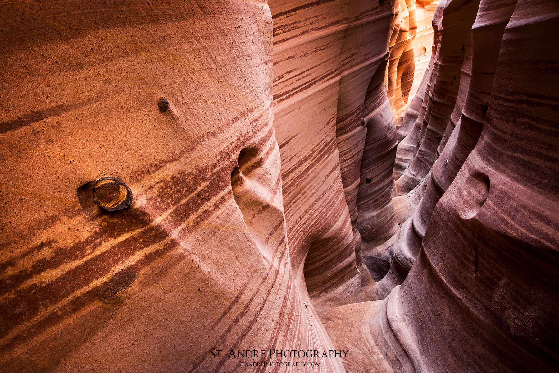 Moqui ball is coming out of the wall in zebra slot canyon in escalante utah. 